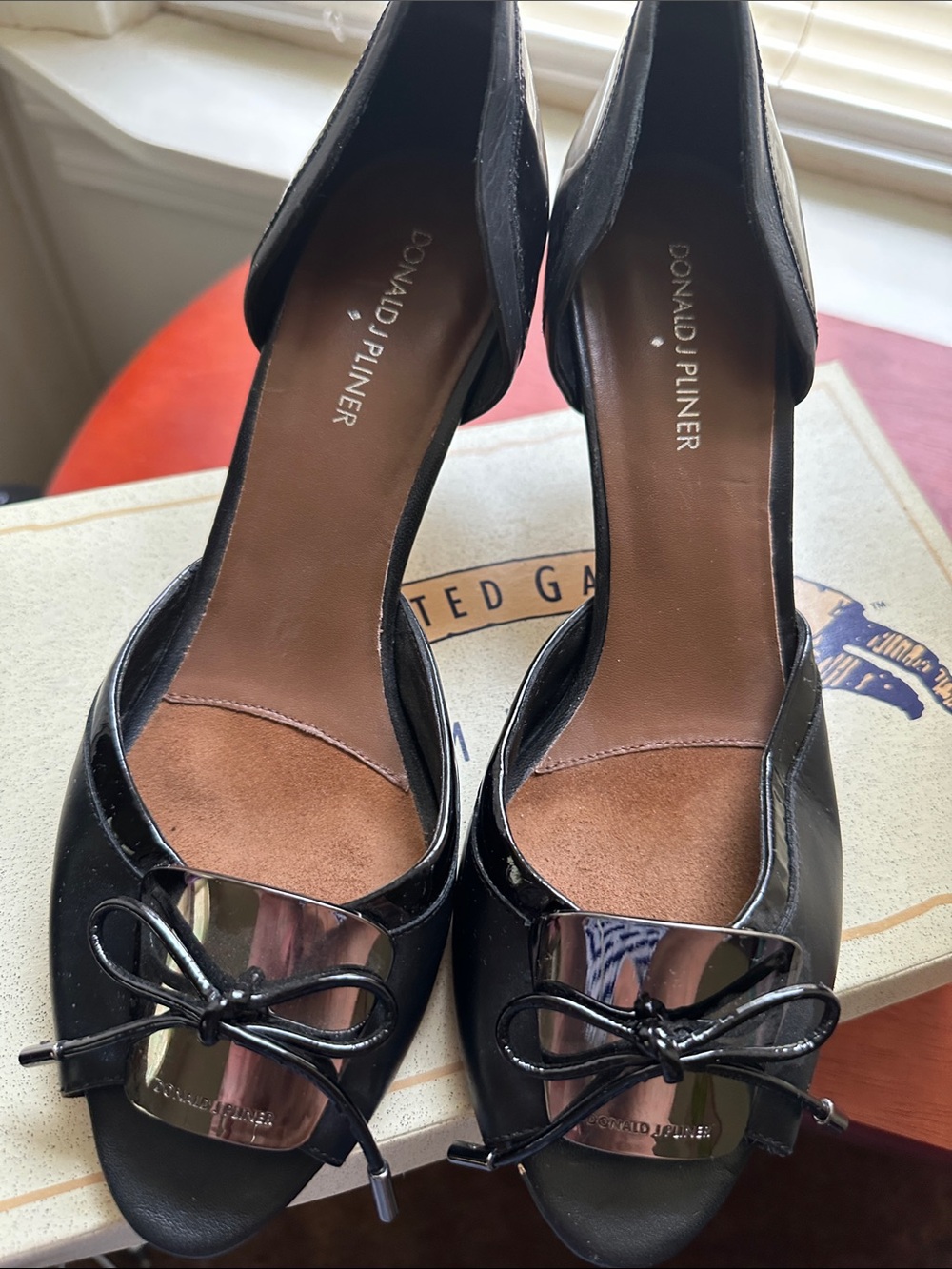 Donald J. Pliner Black Patent Leather Peep-Toe Heels with Metallic Bow Plate